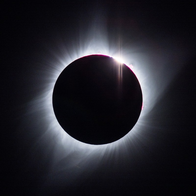 the sun just breaking out from the moon.  