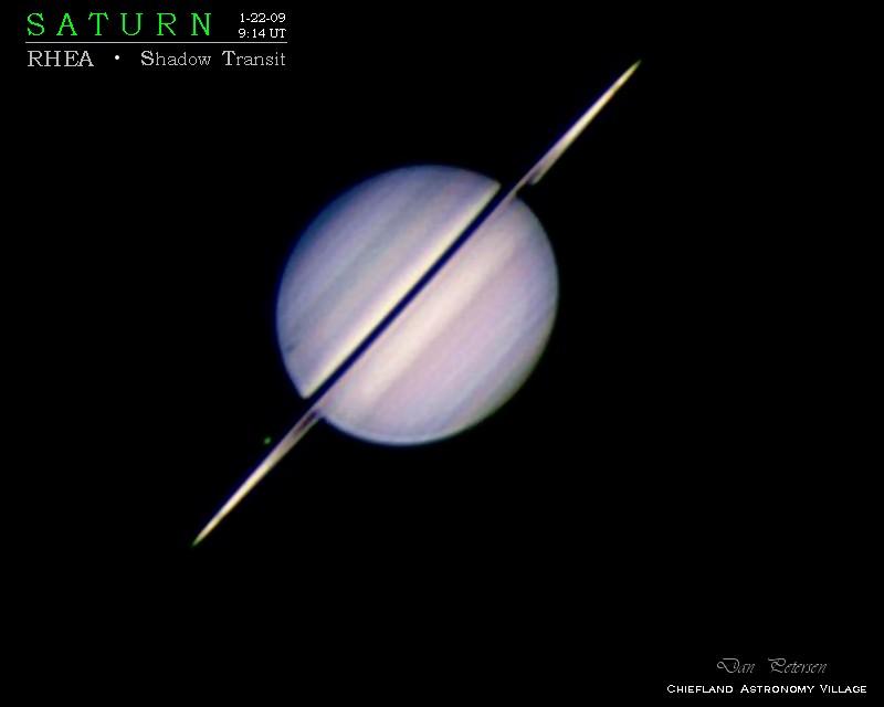 Saturn, Rhea and its shadow!