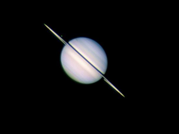 Saturn, Rhea and its shadow