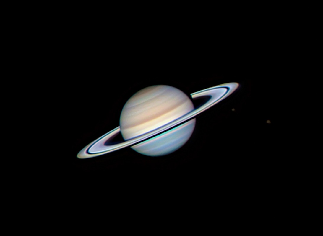 Saturn with moons Tethys and Rhea image