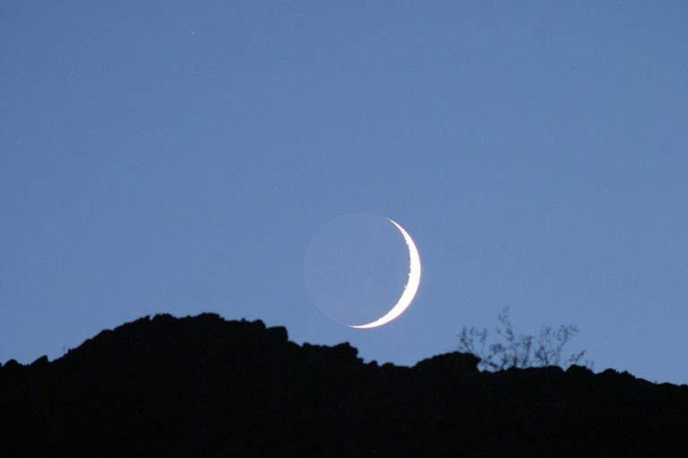 Moon over hill